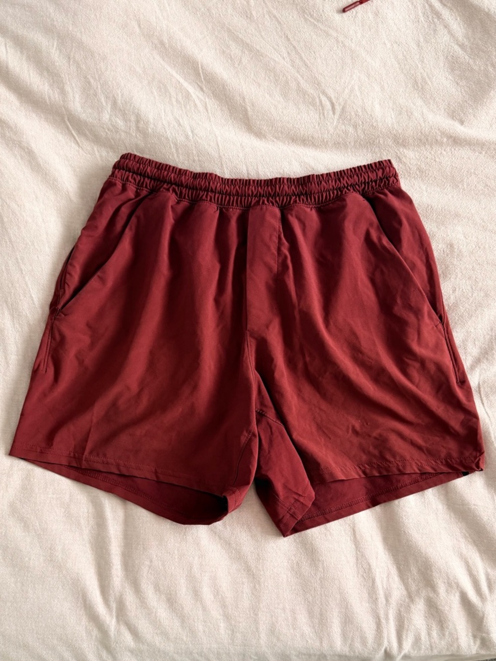 lululemon athletica Men's pace breaker 5” linerless short in Savannah red.